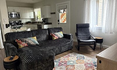 Bright One Bedroom + Den, Ground Level Suite with Private Entrance and Covered Patio