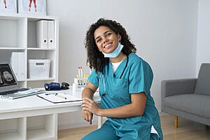 nurse smiling in a fully furnished apartment in canada
