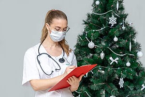 9 Things to Look Out for During Christmas Assignments 2 Female travel nurse writing some records while on Christmas assignments