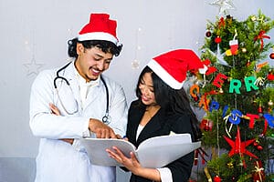 9 Things to Look Out for During Christmas Assignments 4 Female and male travel nurse smiling on Christmas assignments