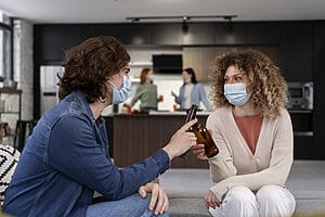2 nurse friends having a conversation in short term apartment
